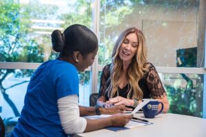 Nursing Program teacher with student on campus