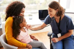 Pediatrician with young patient