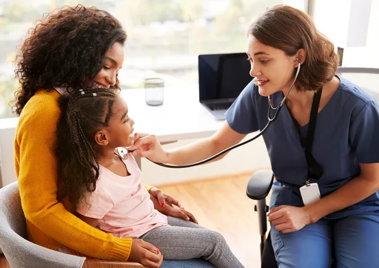 Medical Assistant with young patient