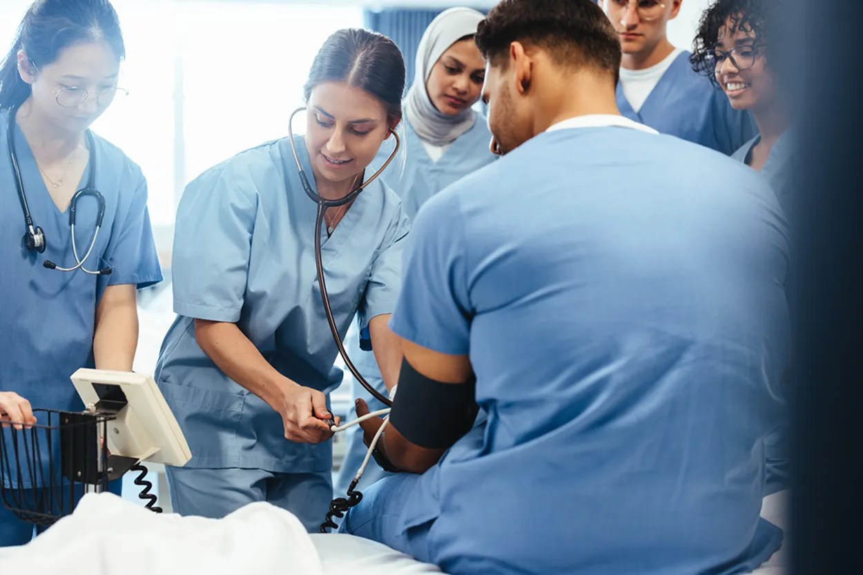 Healthcare Career Program students on campus in lab