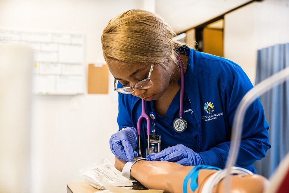 Nursing Program Student on campus in lab