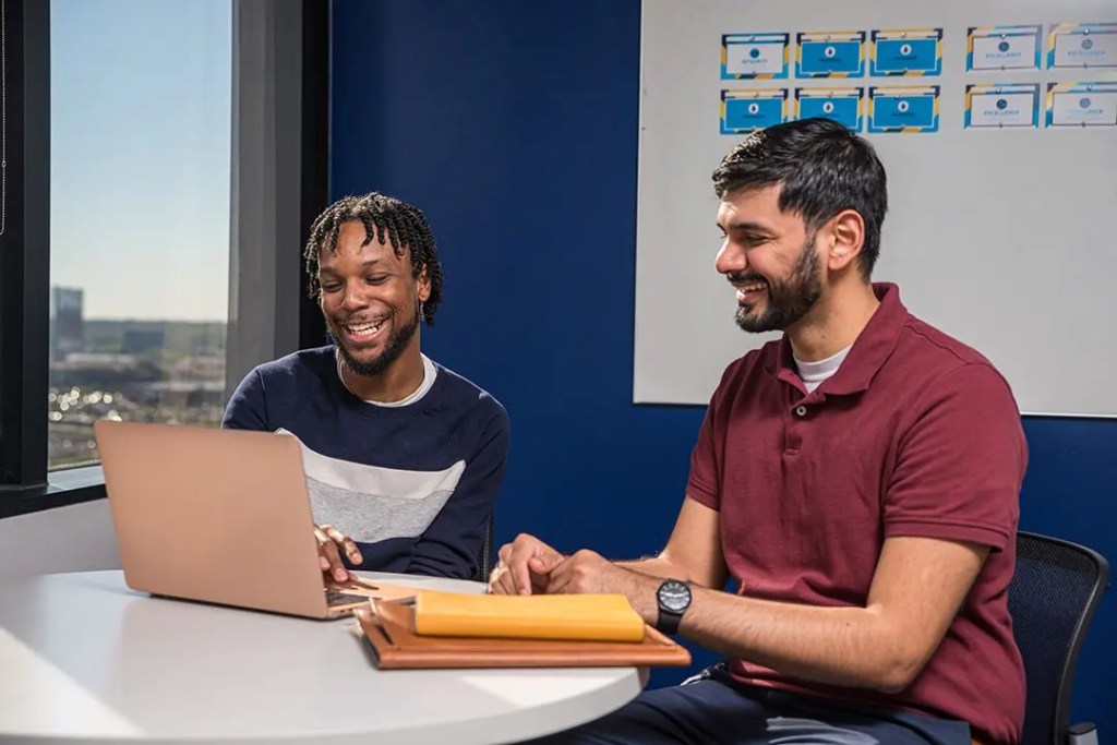 Nursing School Faculty Discussing Nursing College Tuition