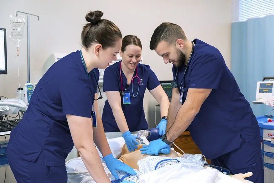 AZCN Colorado Nursing College Students Applying CPR to Dummy