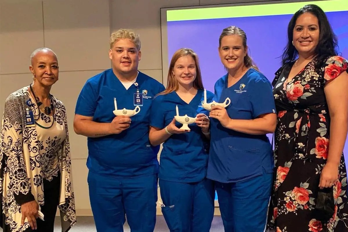 Arizona nursing college students with lamp