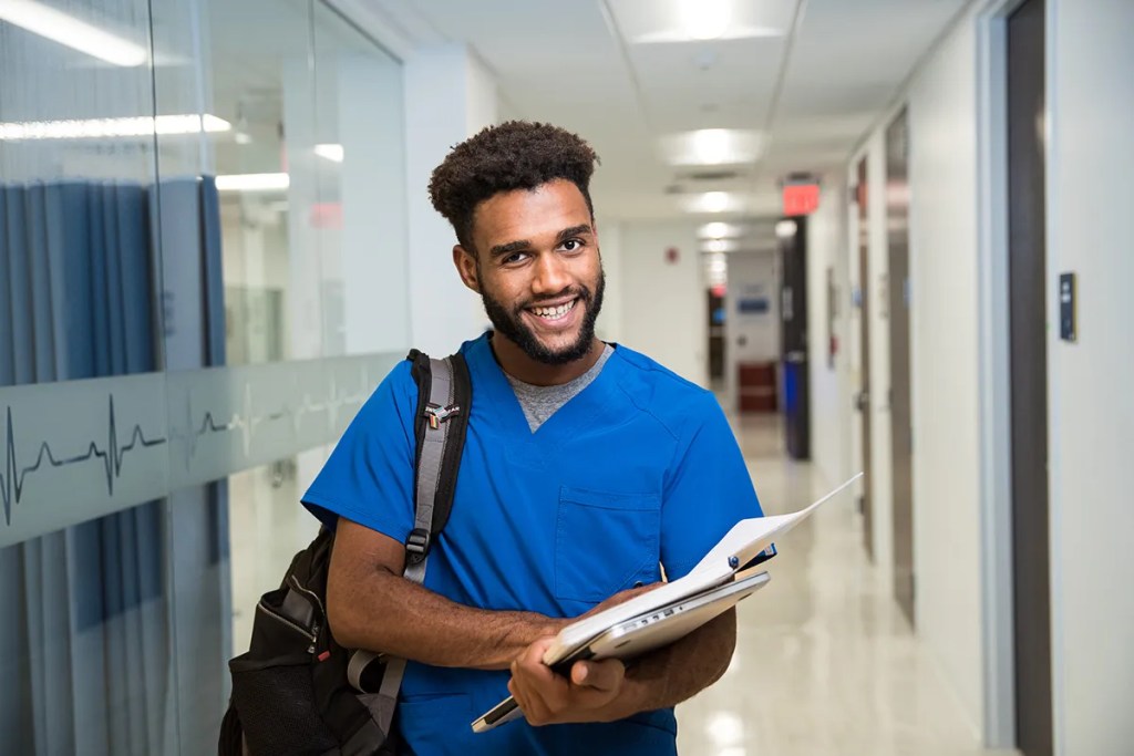 BSN Nursing Program Student Smiling in Hall