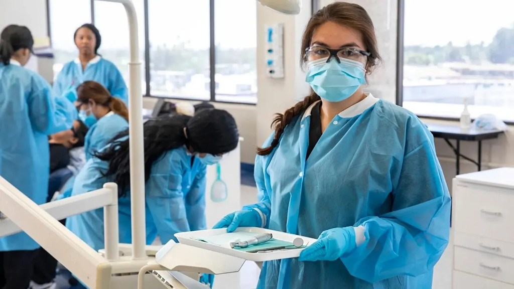 Healthcare student in a clinical learning to become a dental assistant