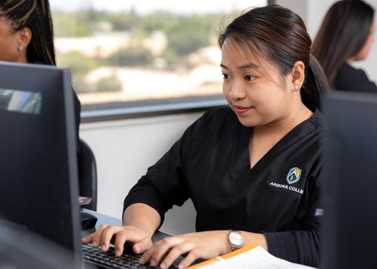 Allied Health program student at the computer at Arizona College