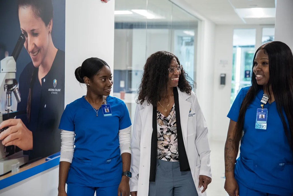 Professor Teaching Two Students About Nursing Certifications